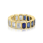 BEZELED EMERALD CUT BLUE SAPPHIRE AND DIAMOND RING