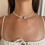 BAGUETTE AND ROUND DIAMOND CHOKER WITH EMERALD CUT COLOMBIAN EMERALD CENTER